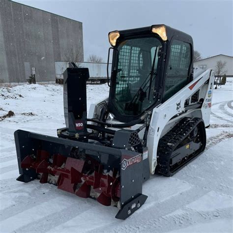 pushing snow with mini skid steer|virnig skid steer attachments.